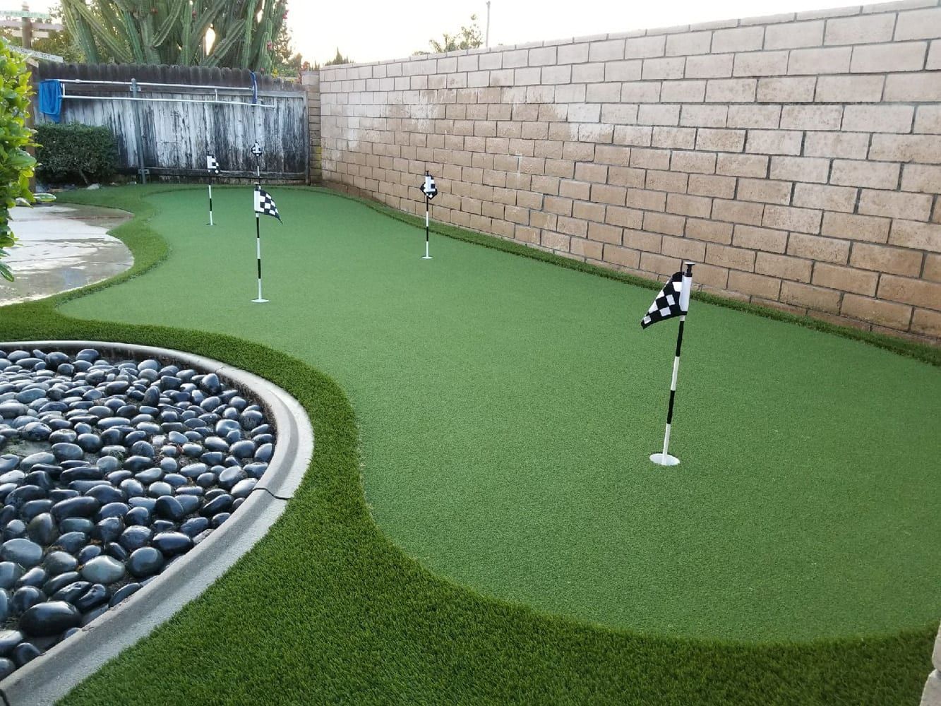 Backyard putting green installed by Always Green